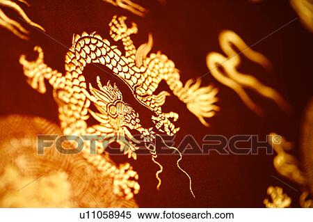 Stock Photography - Chinese style totem on red fabric. Fotosearch
