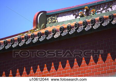 Picture - Chinese traditional building against blue sky, view from below. Fotosearch