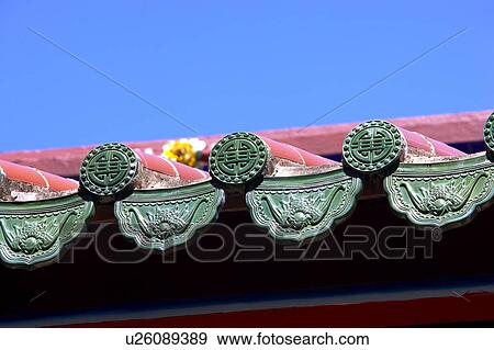 Stock Photo - Chinese traditional building against blue sky, focus on roof. Fotosearch
