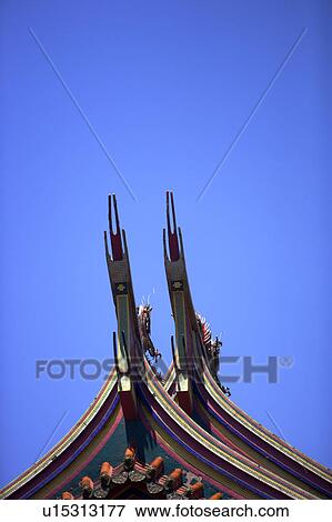 Chinese traditional building roof against blue sky View Large Photo Image Stock Photo - Chinese traditional building roof against blue sky. Fotosearch