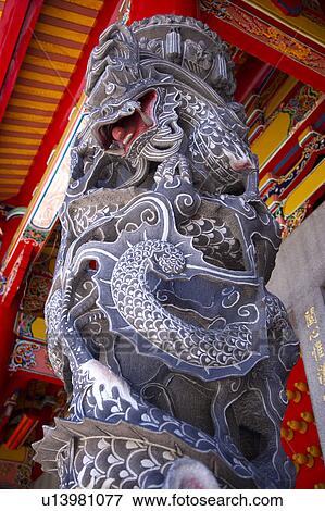Stock Photo - Close-up of a Chinese stone lion, view from below. Fotosearch