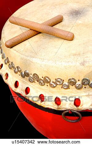 Stock Image - Drum with drumsticks, close-up. Fotosearch