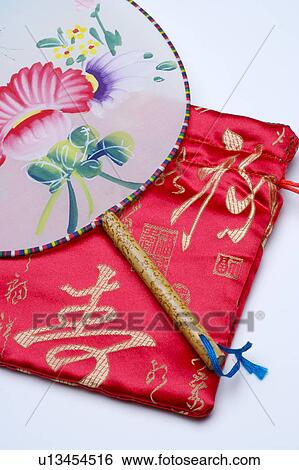Fan and red embroidered Chinese silk bag View Large Photo Image Stock Photograph - Fan and red embroidered Chinese silk bag. Fotosearch