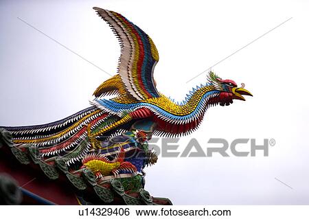 Phoenix sculpture on roof against sky View Large Photo Image Stock Photograph - Phoenix sculpture on roof against sky. Fotosearch