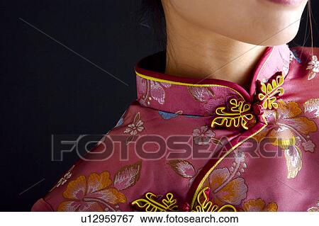 Woman in Cheongsam, close-up View Large Photo Image Stock Photo - Woman in Cheongsam, close-up. Fotosearch