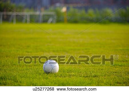 Stock Photo - Ball on soccer field. Fotosearch