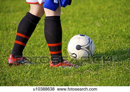 Soccer player and ball, mid section View Large Photo Image Stock Photo - Soccer player and ball, mid section. Fotosearch