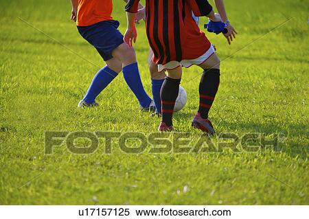 Stock Photography - Soccer players, mid section. Fotosearch