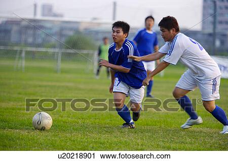 Stock Image - Soccer players. Fotosearch