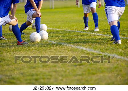 Soccer players warming up, mid section View Large Photo Image Stock Photo - Soccer players warming up, mid section. Fotosearch