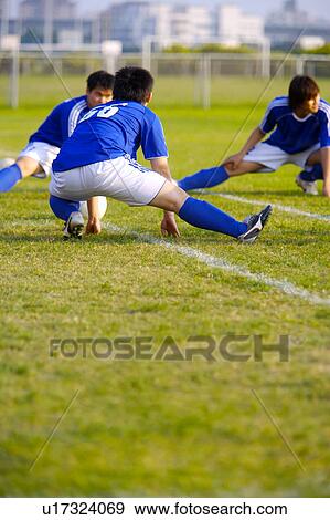 Stock Photo - Soccer players warming up. Fotosearch