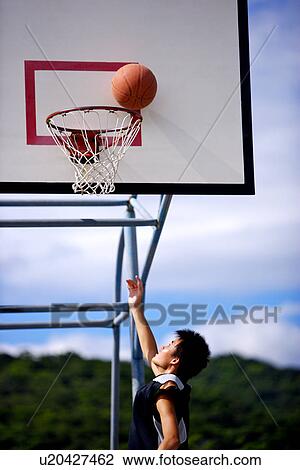 Basketball at the edge of hoop View Large Photo Image Stock Image - Basketball at the edge of hoop. Fotosearch