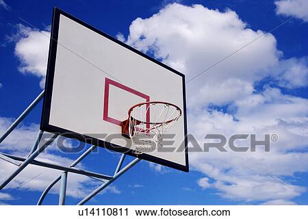 Basketball hoop against blue sky View Large Photo Image Stock Image - Basketball hoop against blue sky. Fotosearch