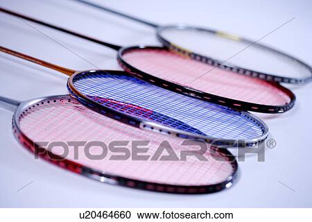 Stock Image - Four badminton rackets, close up. Fotosearch