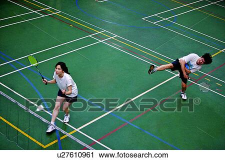 Man and woman, teammates, playing badminton View Large Photo Image Stock Image - Man and woman, teammates, playing badminton. Fotosearch
