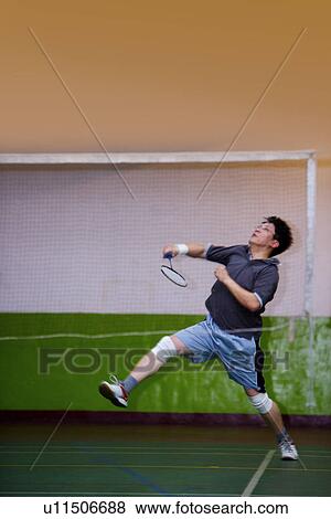 Man playing badminton View Large Photo Image Stock Photo - Man playing badminton. Fotosearch