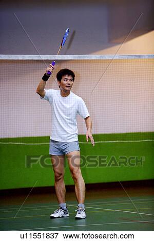 Stock Photo - Man Playing Badminton. Fotosearch