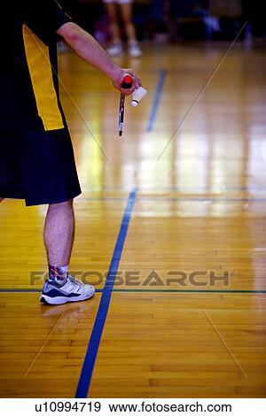 Man prepares to serve during a game of badminton View Large Photo Image Stock Photo - Man prepares to serve during a game of badminton. Fotosearch