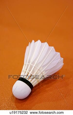 Stock Image - Shuttlecock on badminton court. Fotosearch