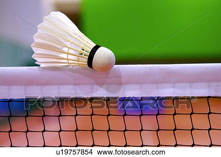 Picture - Shuttlecock on top of net, close up. Fotosearch