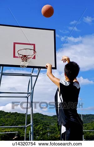 Picture - Teenage boy making a basket. Fotosearch