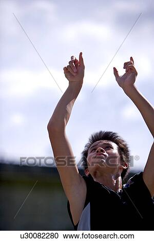 Teenage boy throwing a basketball View Large Photo Image Stock Image - Teenage boy throwing a basketball. Fotosearch