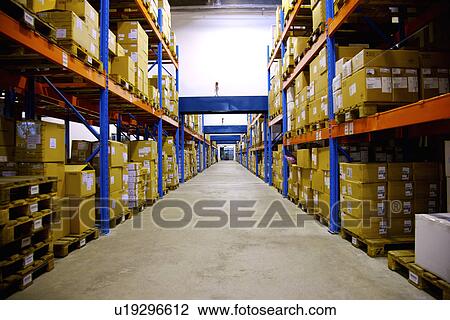 Aisle of boxes on shelves in warehouse View Large Photo Image Stock Image - Aisle of boxes on shelves in warehouse. Fotosearch