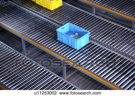 Stock Image - Boxes on conveyor belt in warehouse. Fotosearch