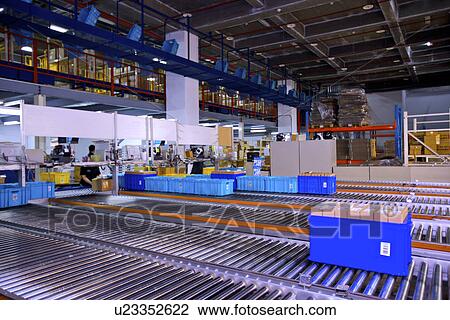 Boxes on conveyor belt View Large Photo Image Stock Image - Boxes on conveyor belt. Fotosearch