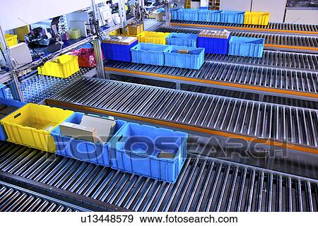 Boxes on conveyor belt View Large Photo Image Stock Photo - Boxes on conveyor belt. Fotosearch