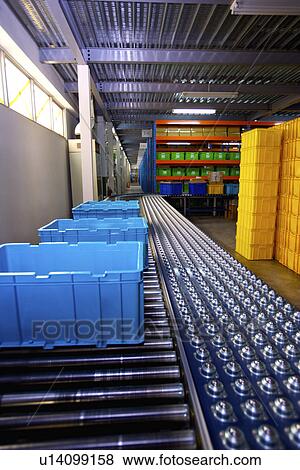 Boxes on conveyor belt View Large Photo Image Stock Photo - Boxes on conveyor belt. Fotosearch