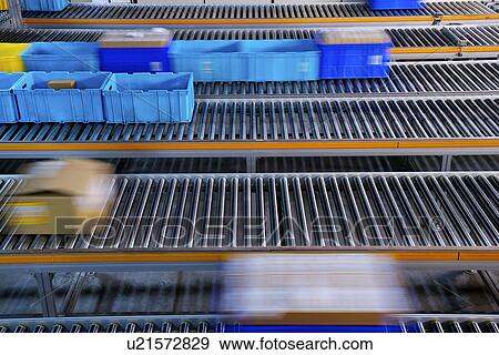 Boxes on conveyor belt View Large Photo Image Stock Photo - Boxes on conveyor belt. Fotosearch
