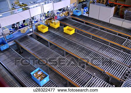 Boxes on conveyor belt View Large Photo Image Stock Photo - Boxes on conveyor belt. Fotosearch
