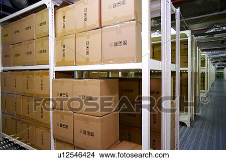 Picture - Boxes on shelves in warehouse. Fotosearch