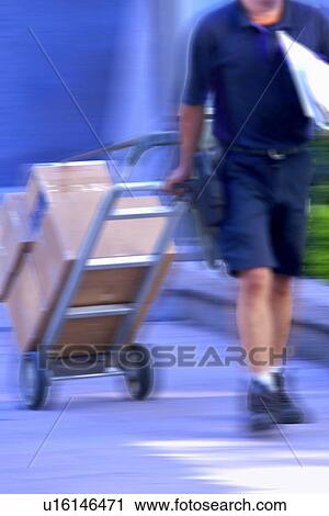 Man with Boxes on Hand Truck View Large Photo Image Stock Image - Man with Boxes on Hand Truck. Fotosearch