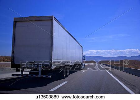 Semi-truck on a highway View Large Photo Image Stock Photo - Semi-truck on a highway. Fotosearch