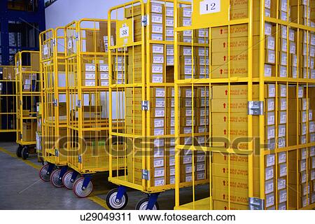 Stock Image - Shelves stacked with boxes. Fotosearch
