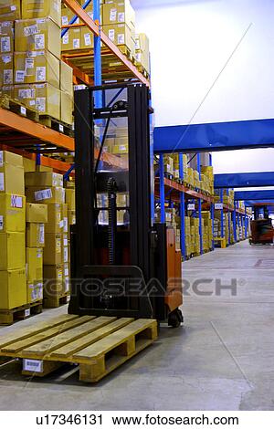 Stock Image - Warehouse shelves stacked with boxes. Fotosearch