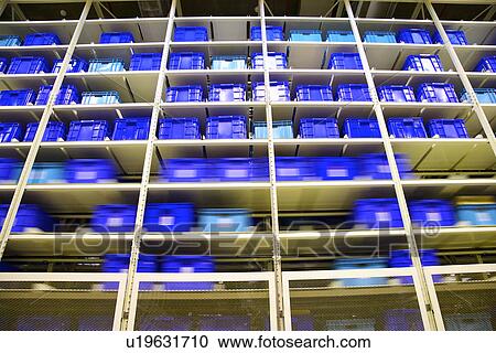 Warehouse shelves stacked with boxes View Large Photo Image Stock Image - Warehouse shelves stacked with boxes. Fotosearch
