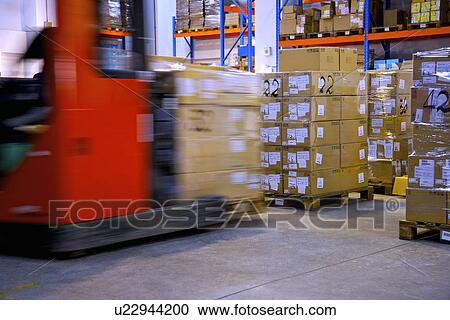 Warehouse shelves stacked with boxes and forklift View Large Photo Image Stock Image - Warehouse shelves stacked with boxes and forklift. Fotosearch