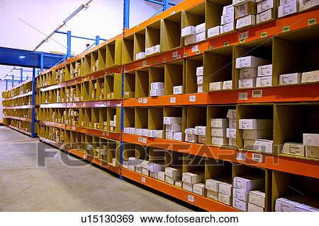 Stock Photo - Warehouse shelves stacked with boxes. Fotosearch