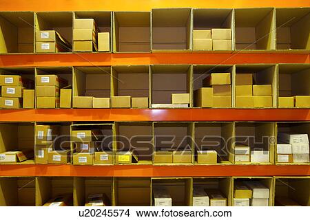 Picture - Warehouse shelves stacked with small boxes. Fotosearch