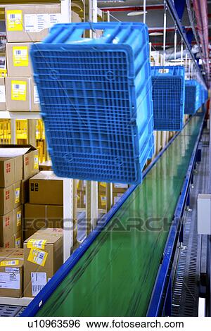 Stock Photograph - Warehouse with blue plastic boxes. Fotosearch