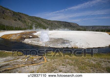 Stock Image - Cliff Geyser, Black Sand Basin, Yellowstone National Park, Wyoming, USA. Fotosearch