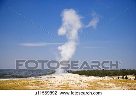 Stock Image - USA, Wyoming, Yellowstone National Park, Old Faithful. Fotosearch