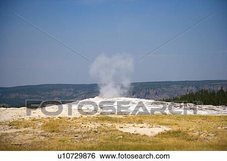 Stock Photograph - USA, Wyoming, Yellowstone National Park, Old Faithful. Fotosearch