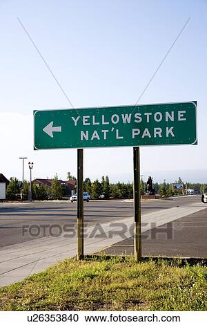 Stock Image - Sign ' Yellowstone Nat'l Park' by road. Fotosearch