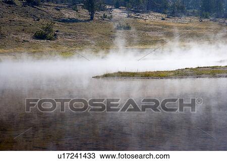 Stock Image - Smoke over Yellowstone National Park, Wyoming, USA. Fotosearch
