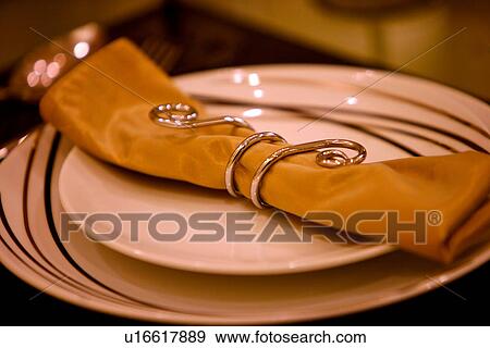 Stock Photo - Formal table setting with napkin, close-up. Fotosearch