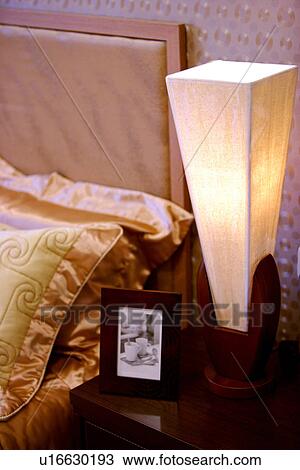Stock Image - Lamp by bed. Fotosearch